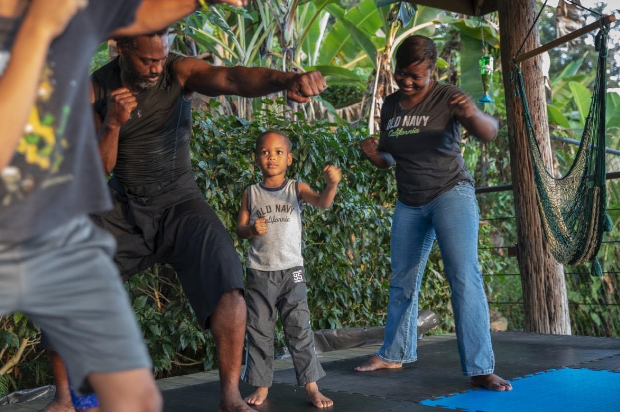 Family training together — mom, dad, and child